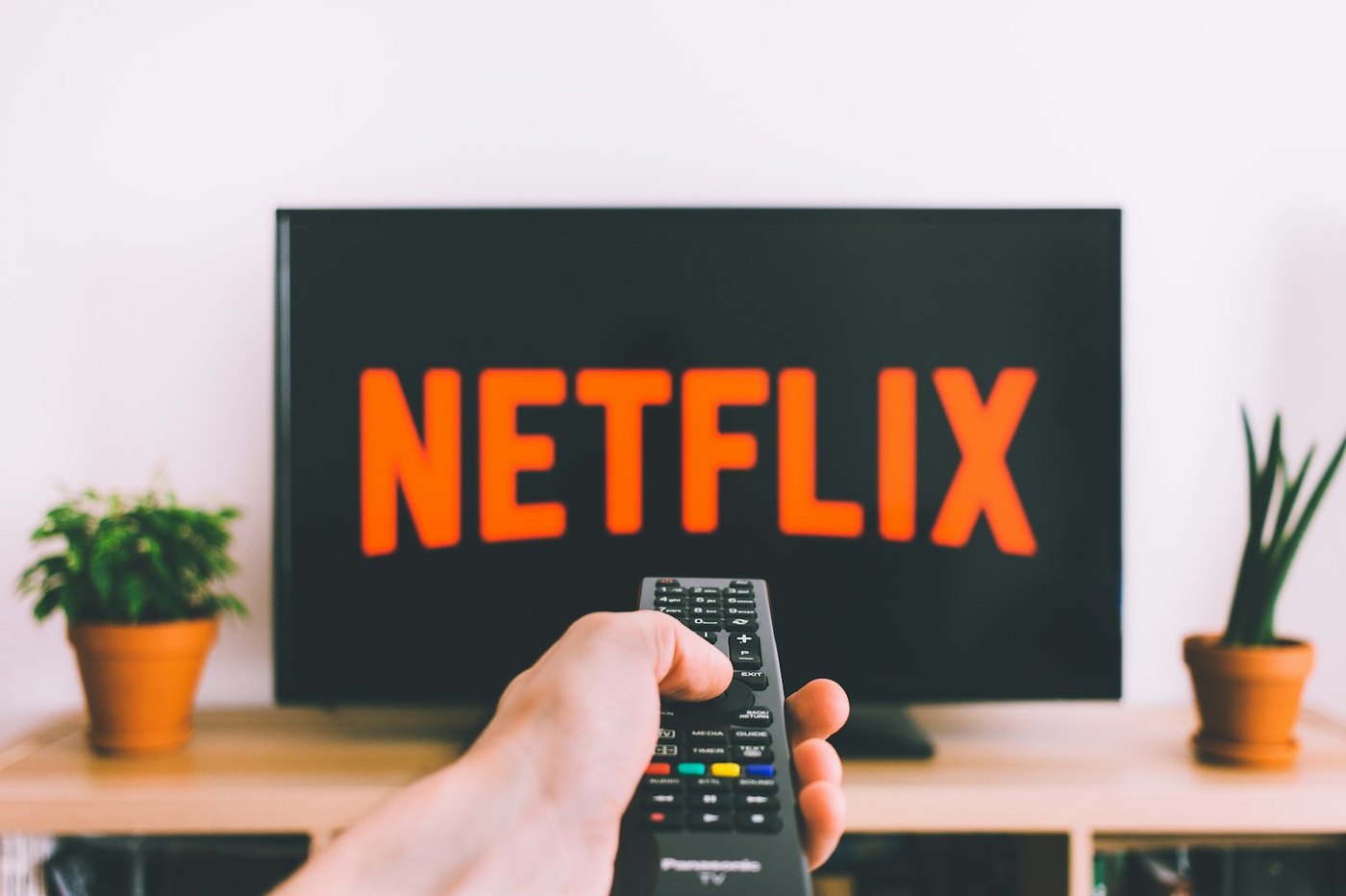 People watching television together on a sofa