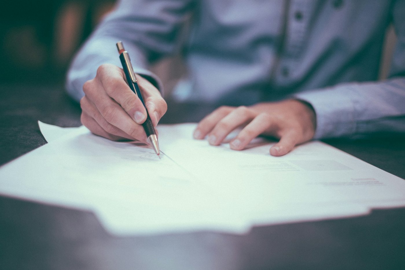 A person signing a printed agreement