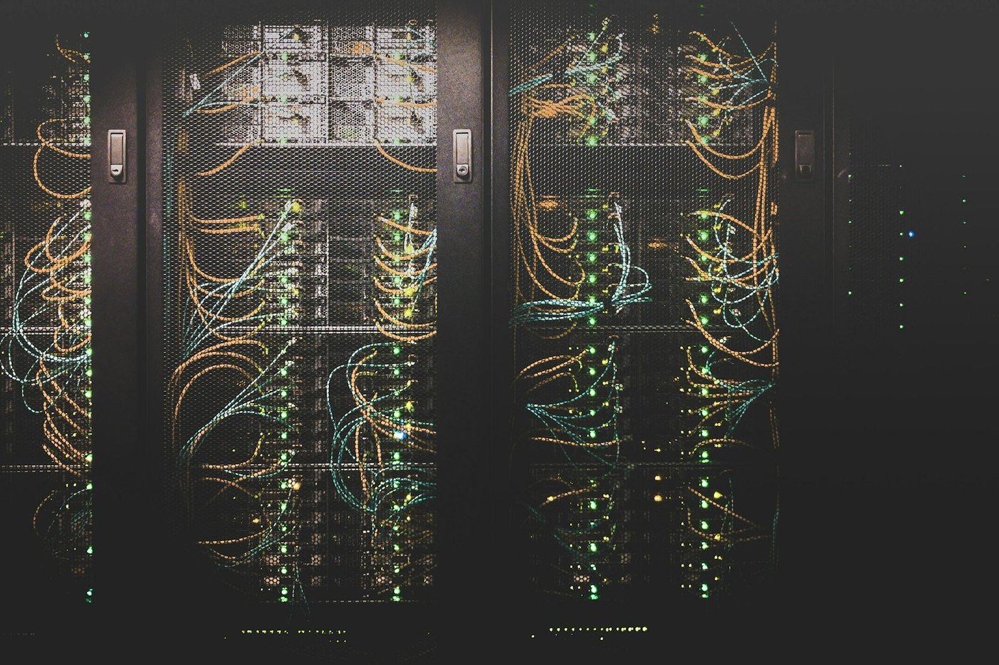 Server racks with network cables in a data hall