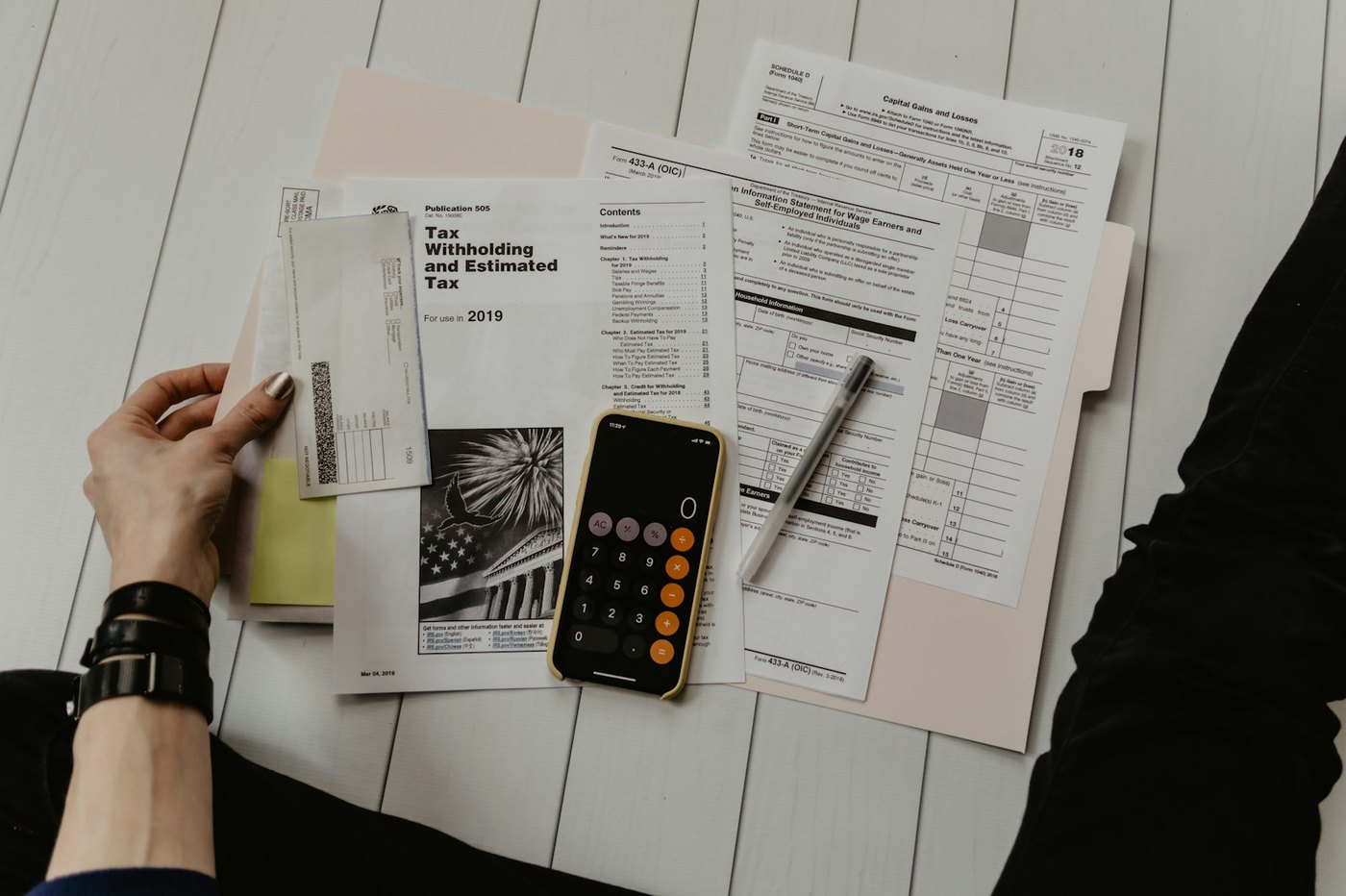 Reviewing a paper bill with a calculator